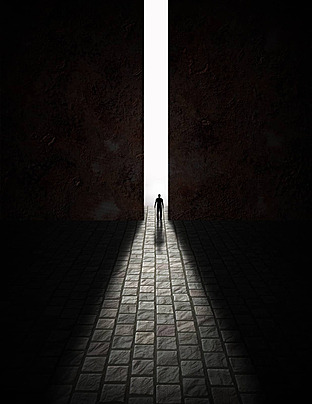 A door cracked open to reveal glowing light